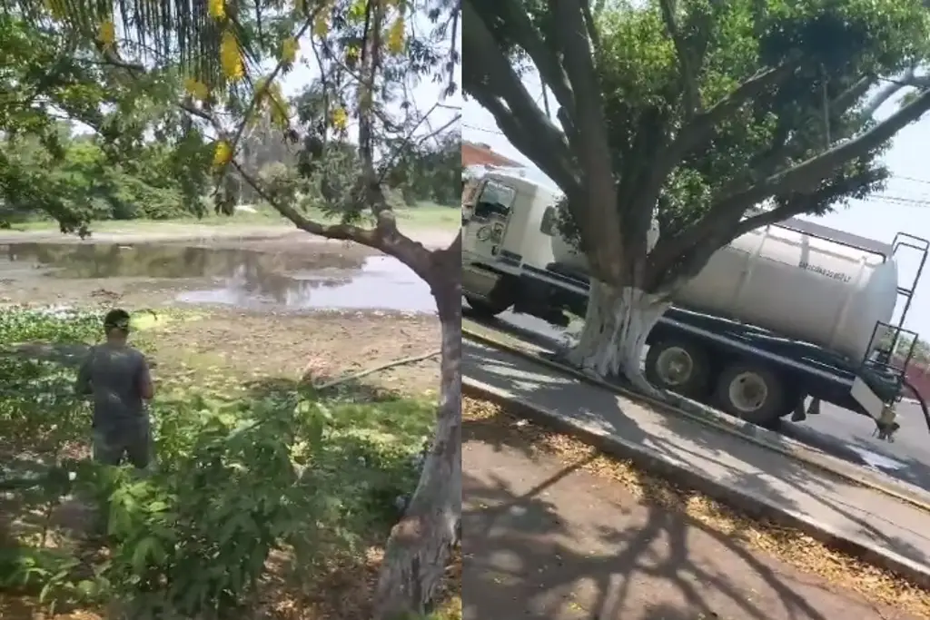 Hombre compra pipas de agua para vaciarlas en Laguna de Lagartos en Veracruz