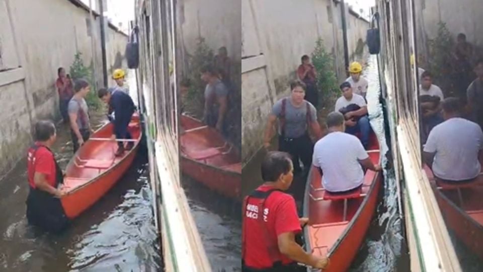 Con lancha, rescatan a pasajeros de camión varado en colonia de Veracruz tras lluvias